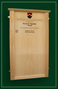 Eastbury Comprehensive School An honour board in solid beech with fluted columns and ogee capping piece.